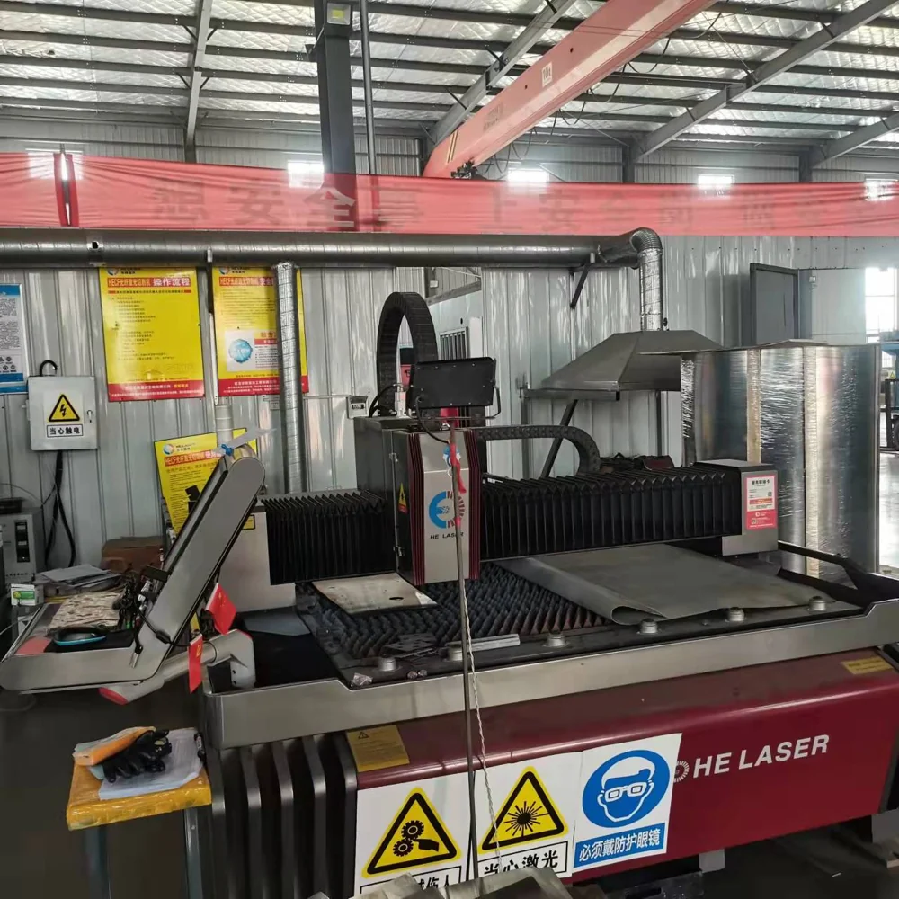 Laser cutting equipment with a sheet-metal processing table